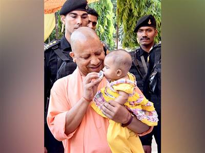 Uttar Pradesh CM Adityanath performs 'annaprashan' for daughter of divyang sweeper in Gorakhpur