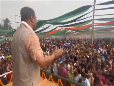 Assam CM dances in rain at BJP rally in Kokrajhar