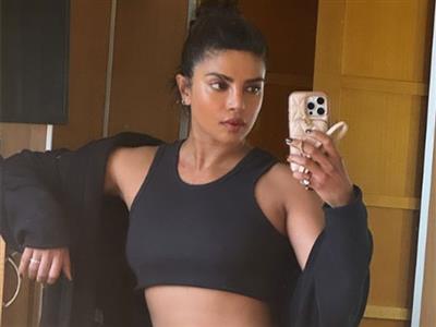 Priyanka Chopra flaunts her toned- muscles in 'between shots selfie' from the Heads of State set