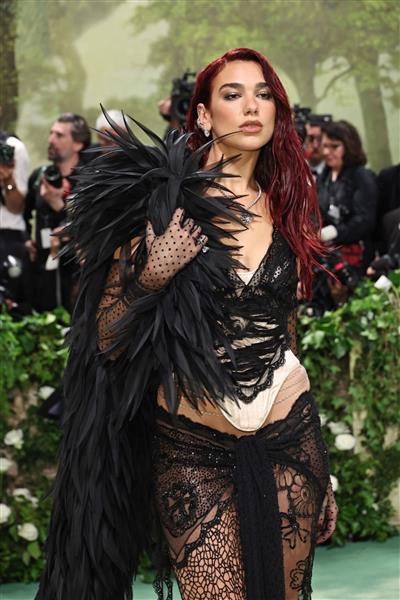 Met Gala: Dua Lipa strikes a pose in black lace gown