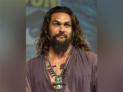 Cannes: Jason Momoa walks red carpet with Adria Arjona