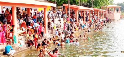 Uttar Pradesh: Devotees take holy dip in River Ganga, offer prayers on Jyeshtha Purnima