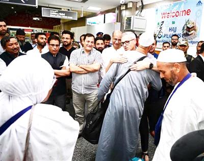 Jammu and Kashmir CM Omar Abdullah receives first batch of Hajj pilgrims at Srinagar airport