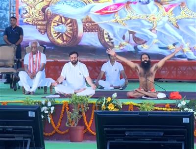 Haryana CM Nayab Singh Saini, Governor Bandaru Dattatreya perform Yoga under guidance of Yoga Guru Swami Ramdev in Kurukshetra