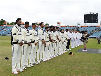 India and England players wear black armbands to pay tribute to Dilip Doshi