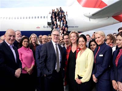 British PM Starmer joins his business delegation for a photo at London's Heathrow airport ahead of India visit