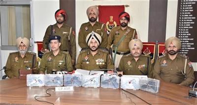 Two linked to cross border smuggling module held with seven sophisticated pistols