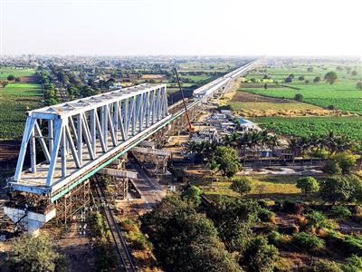130 m span of a 230 m long steel bridge launched over NH-64 & Indian Railway tracks for Bullet Train Project
