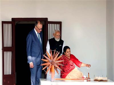 PM Modi, German Chancellor Merz observe charkha spinning at Sabarmati Gandhi Ashram