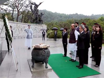 Defence Minister Rajnath Singh pays tribute at South Korea's Seoul National Cemetery
