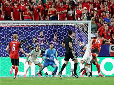Last-gasp Austria break Iran hearts as six-goal thrilling tie with Algeria sends both teams into knockouts
