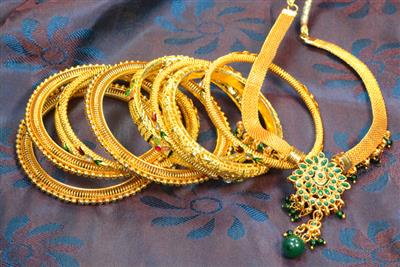 Gold falls nearly 1%, silver slips up to 2% on firm dollar